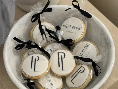 Cookies printed with a client's logo, boxed and ribboned for corporate gifting