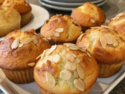 A tray of almond-topped muffins